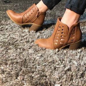 Tan booties with decorative cutouts